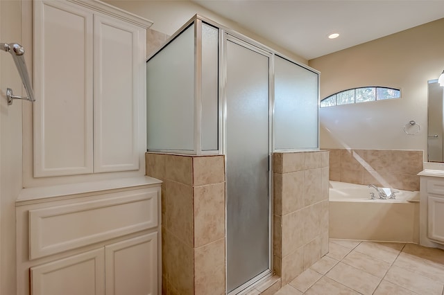 bathroom with vanity, shower with separate bathtub, and tile patterned flooring