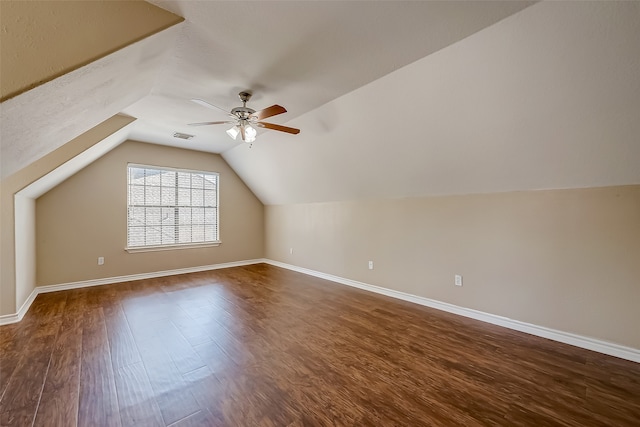 additional living space featuring lofted ceiling, ceiling fan, and dark hardwood / wood-style flooring