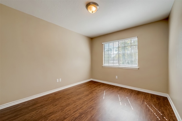 empty room featuring wood-type flooring