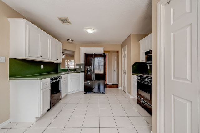 kitchen featuring black appliances, sink, ceiling fan, white cabinets, and light tile patterned floors