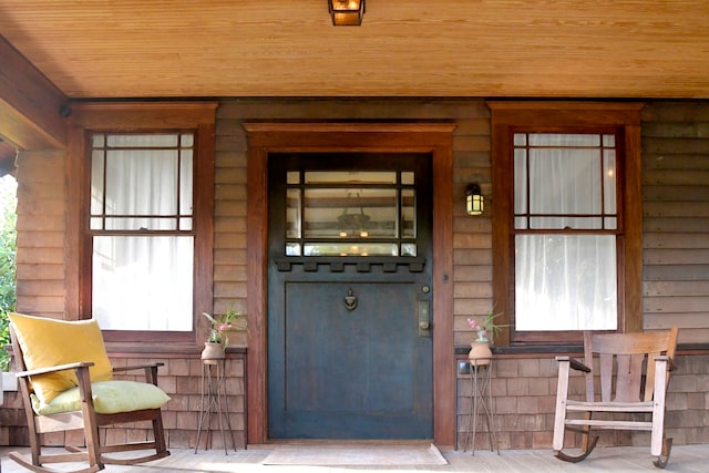 doorway to property featuring a porch