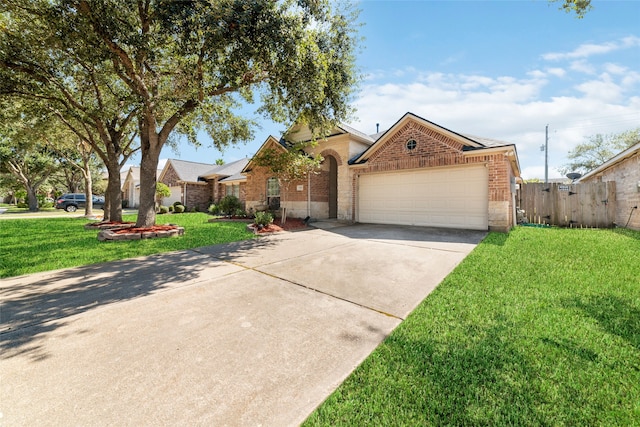 view of front of property with a front lawn and a garage