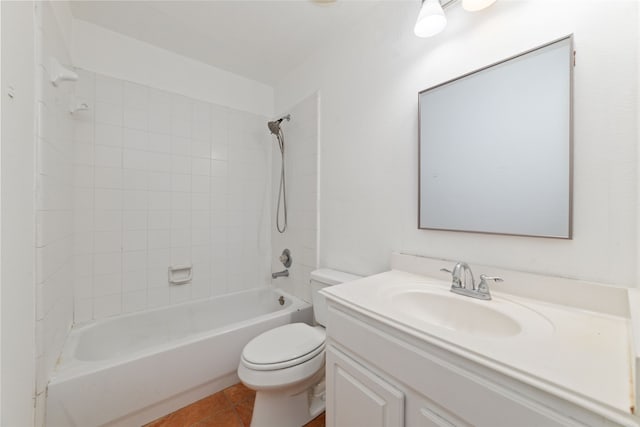 full bathroom featuring tile patterned flooring, tiled shower / bath combo, vanity, and toilet