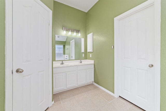 bathroom with tile patterned floors and vanity