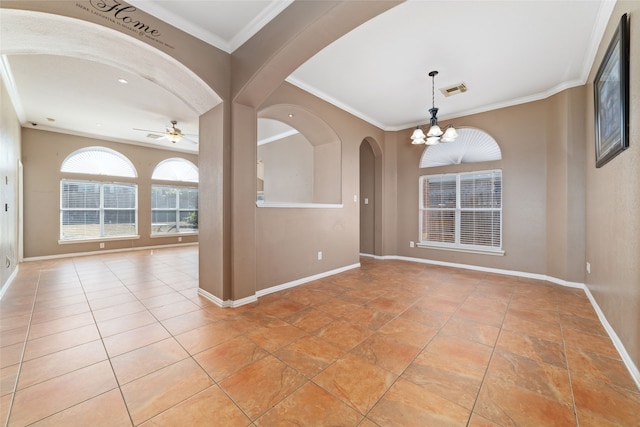 empty room featuring ornamental molding and ceiling fan with notable chandelier