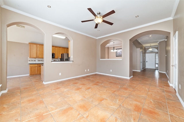 spare room with ceiling fan with notable chandelier, crown molding, and sink