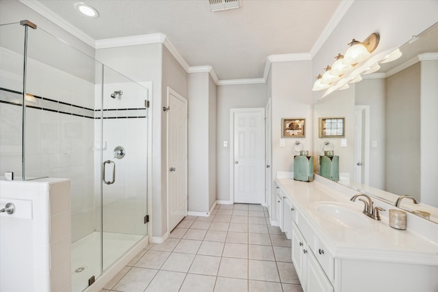 bathroom featuring tile patterned flooring, vanity, a shower with door, and ornamental molding