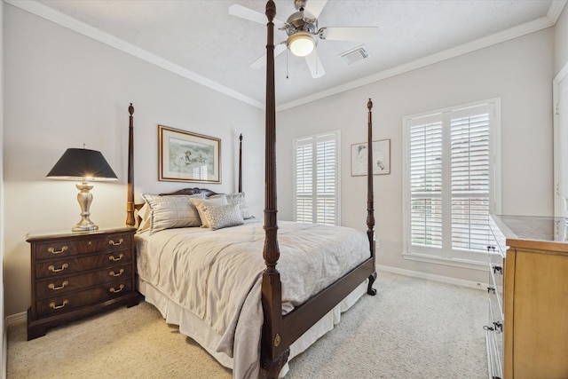 bedroom with light carpet, ceiling fan, and crown molding