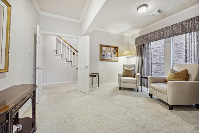 sitting room with light colored carpet and ornamental molding