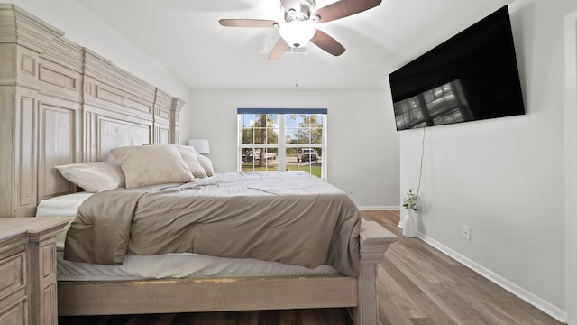 bedroom featuring ceiling fan and light hardwood / wood-style floors