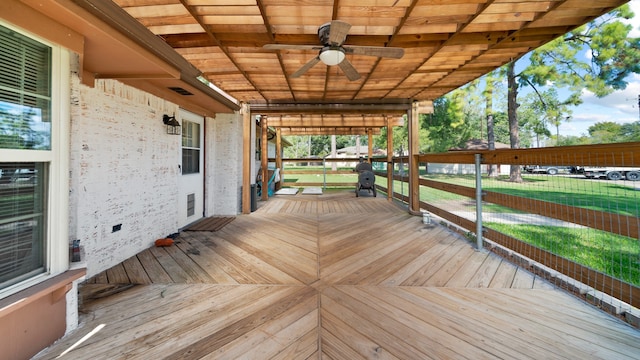 wooden deck featuring ceiling fan