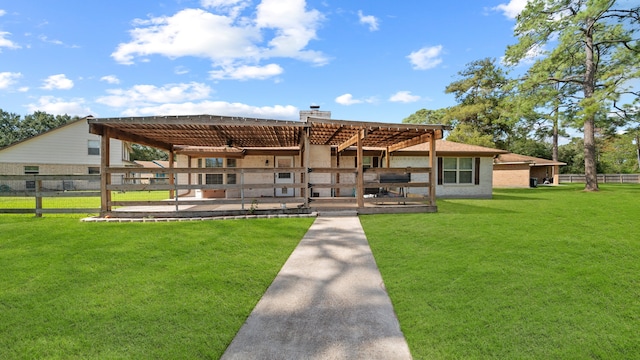 rear view of property featuring a patio area, a lawn, and a pergola