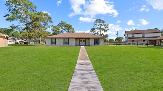 back of property featuring a lawn