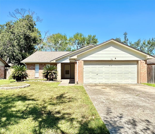 ranch-style home featuring a garage and a front yard