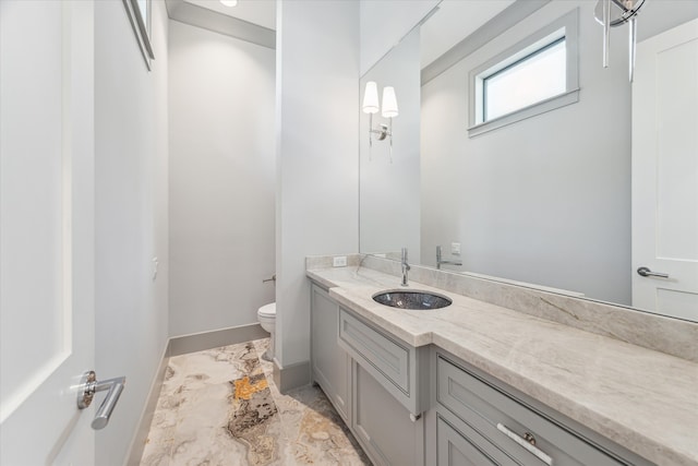 bathroom with vanity and toilet