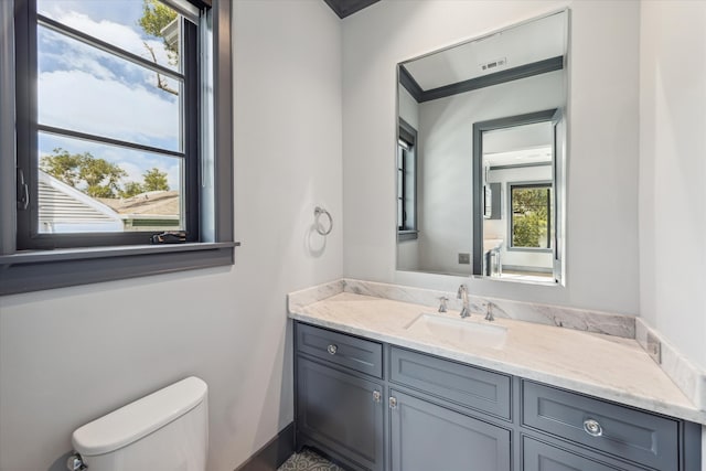 bathroom with vanity and toilet