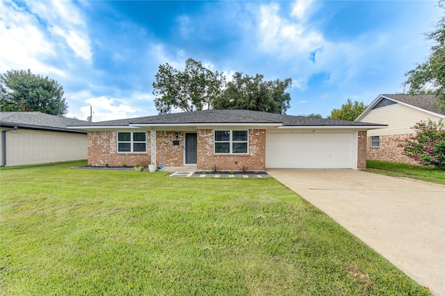 single story home featuring a front lawn and a garage