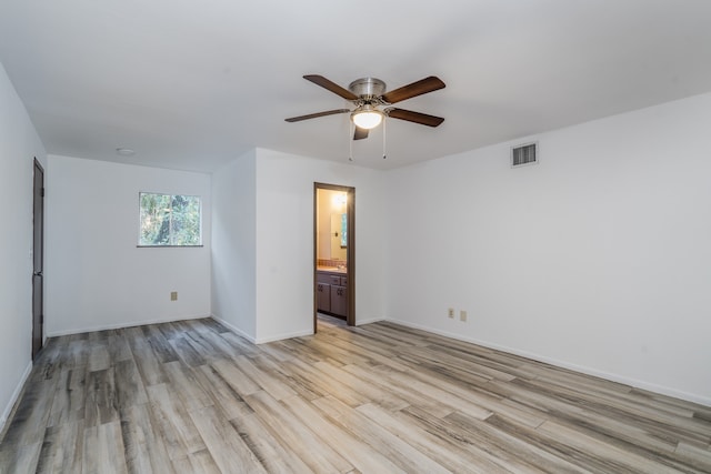 spare room with light hardwood / wood-style flooring and ceiling fan