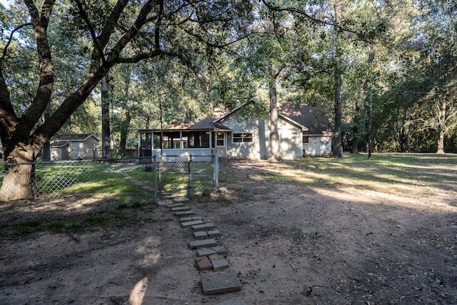 view of yard featuring a sunroom