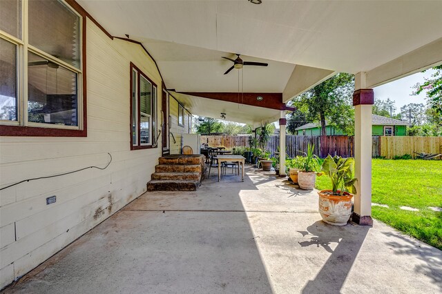 view of patio featuring ceiling fan