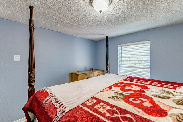 bedroom featuring a textured ceiling