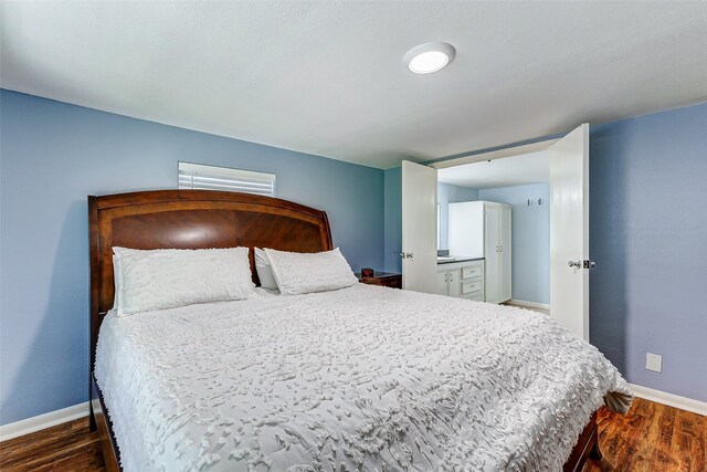 bedroom featuring dark hardwood / wood-style floors