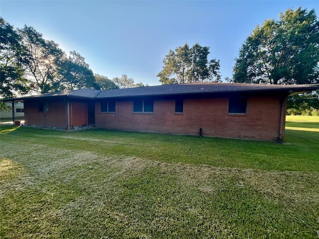 rear view of house with a lawn