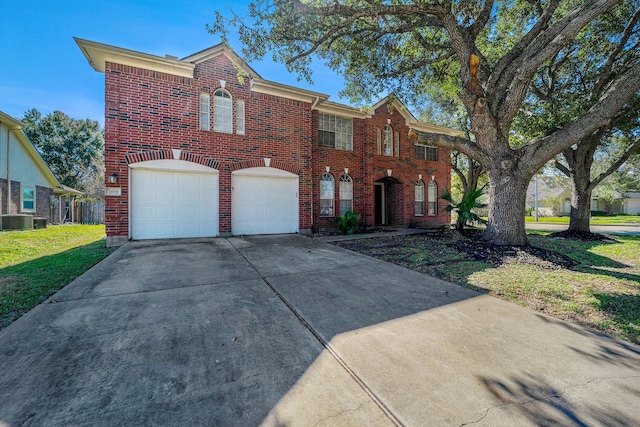 view of property with a garage, a front lawn, and central air condition unit