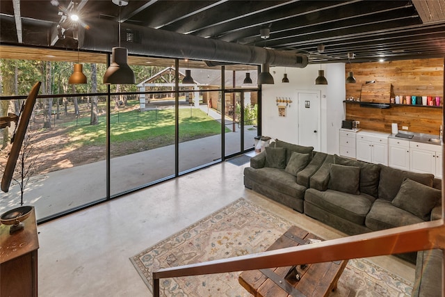 living room featuring wooden walls