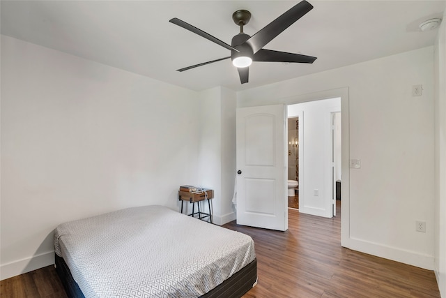 bedroom featuring ceiling fan and dark wood-type flooring