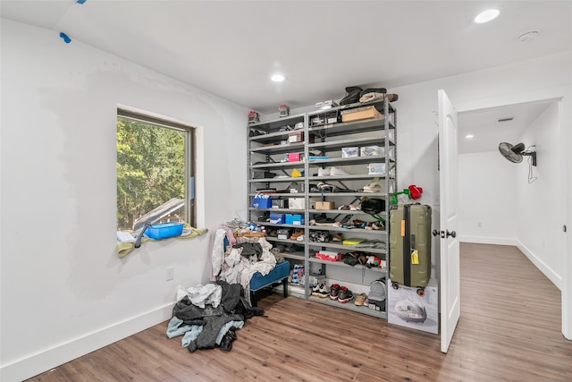 walk in closet with hardwood / wood-style floors