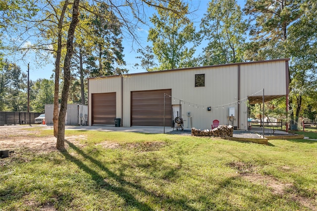 garage featuring a lawn