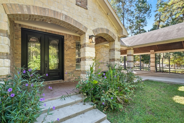 view of exterior entry with a porch