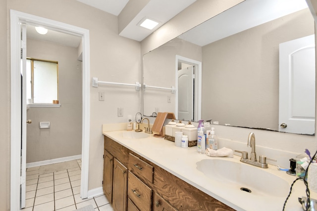 bathroom with tile patterned floors and vanity