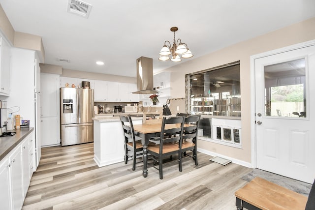 73 Surrey Oak Ct, Alvin, TX 77511 - dining space featuring light wood-type flooring, a chandelier, and recessed lighting