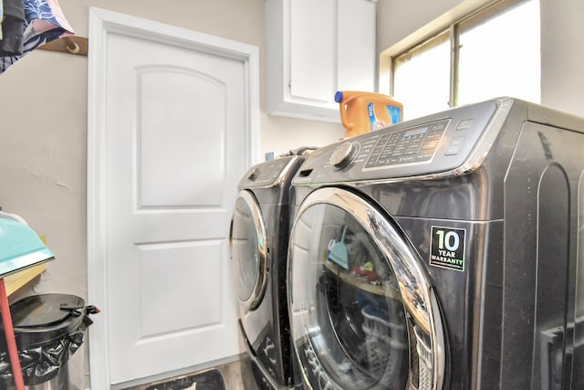 clothes washing area featuring washing machine and clothes dryer