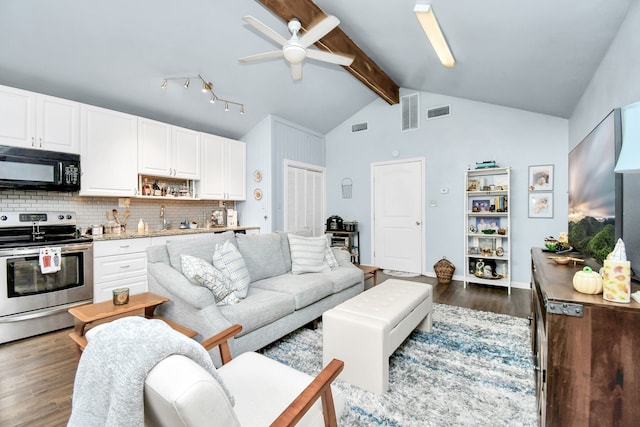 living room featuring ceiling fan, beamed ceiling, sink, dark wood-type flooring, and high vaulted ceiling