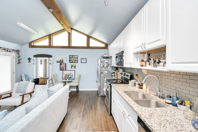 kitchen with tasteful backsplash, sink, stainless steel appliances, dark hardwood / wood-style floors, and white cabinetry