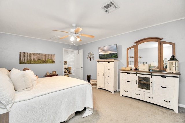 bedroom with ceiling fan and light carpet