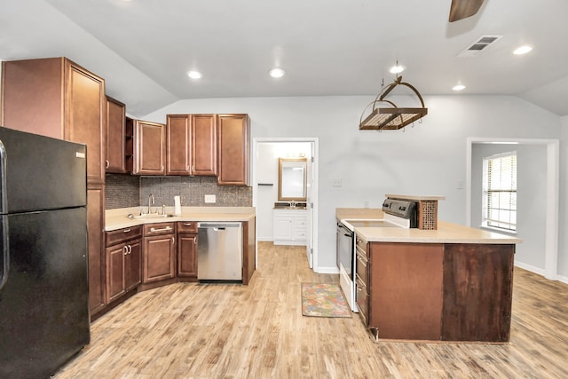 kitchen with stainless steel dishwasher, black refrigerator, light hardwood / wood-style floors, vaulted ceiling, and range with electric cooktop