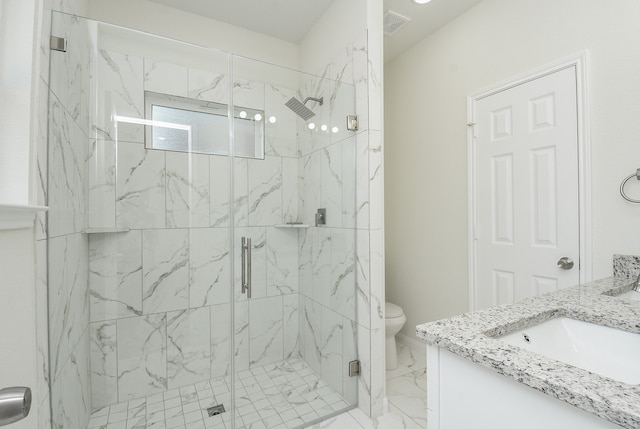 bathroom featuring walk in shower, vanity, and toilet