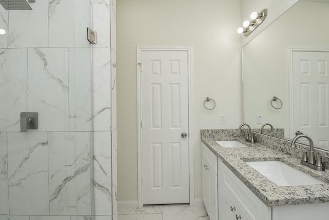 bathroom featuring vanity and tiled shower