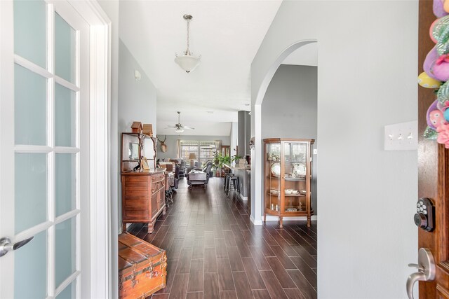 foyer with ceiling fan and dark hardwood / wood-style flooring