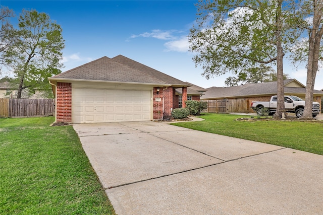 ranch-style home with a garage and a front lawn