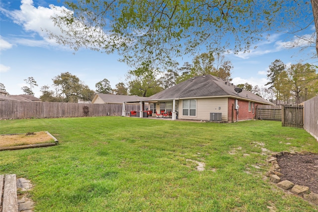 view of yard with a patio and central AC