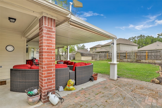 view of patio / terrace featuring an outdoor living space and a shed