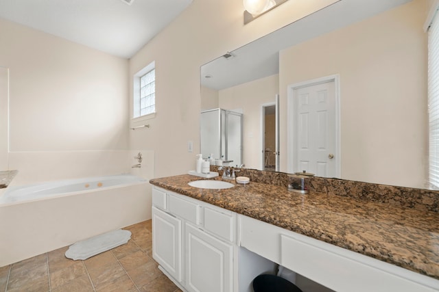 bathroom featuring vanity and separate shower and tub