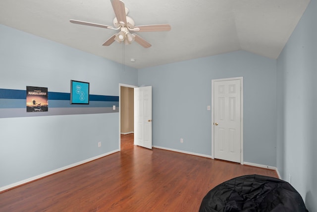 bedroom with lofted ceiling, dark hardwood / wood-style floors, and ceiling fan