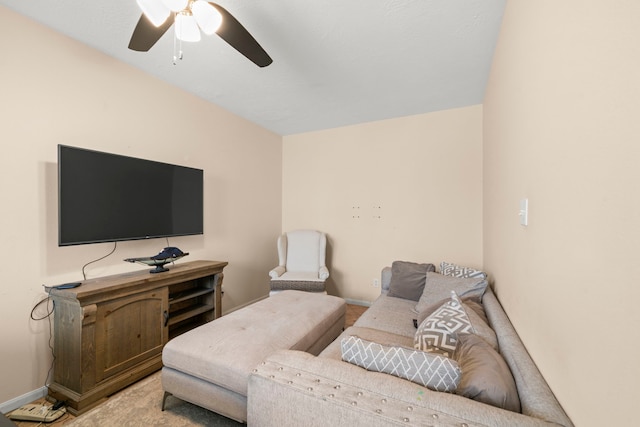 carpeted living room featuring ceiling fan