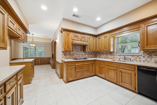 kitchen with black appliances, hanging light fixtures, a healthy amount of sunlight, and sink